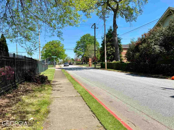 a view of a street with a building in the background