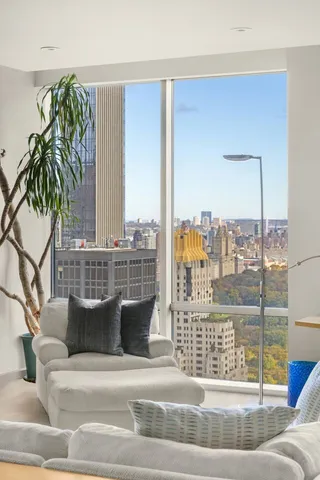 a view of balcony with furniture