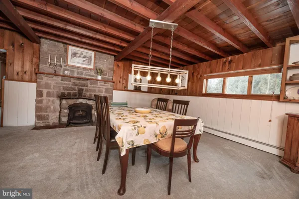 a view of a livingroom with furniture and a fireplace