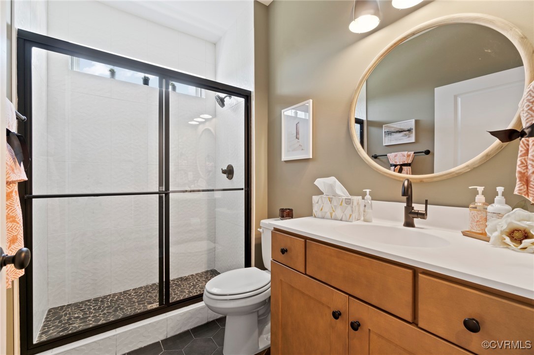Lot 6 Walsingham Way Lanexa, VA 23089 - Photo 19 of 23 a bathroom with a sink a toilet and a mirror