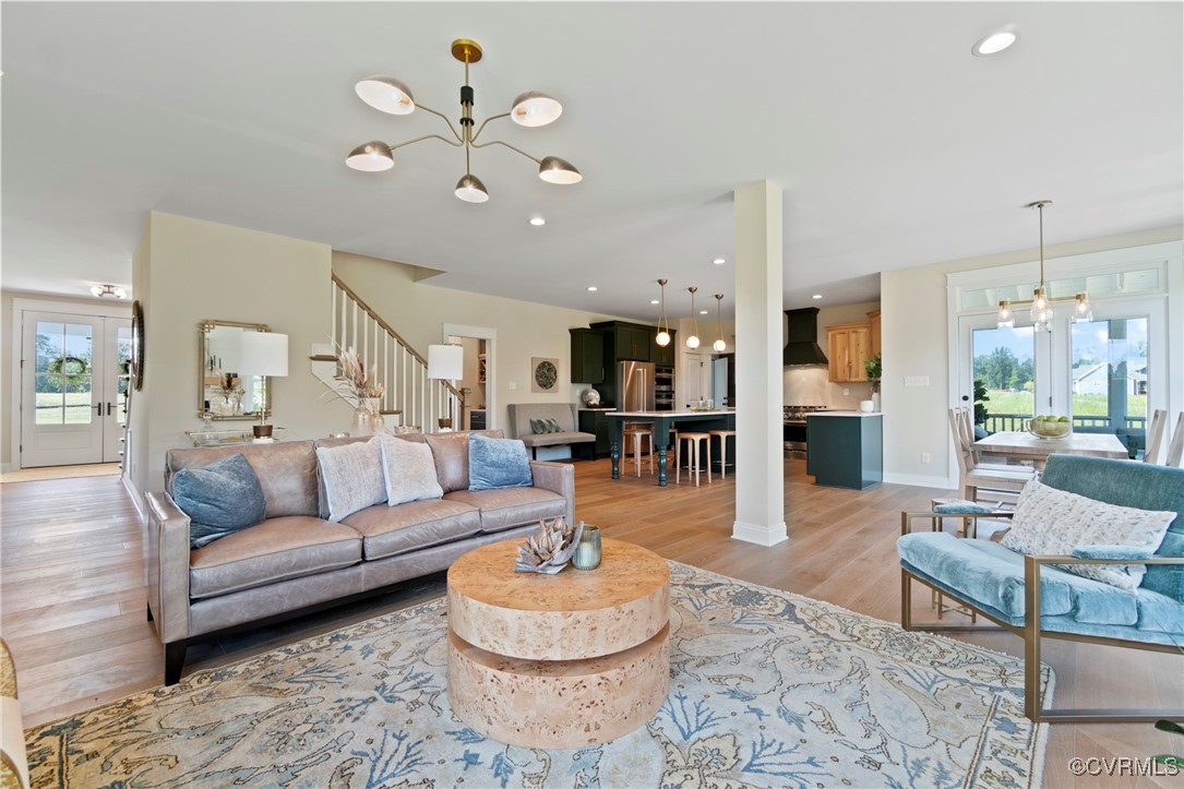 Lot 6 Walsingham Way Lanexa, VA 23089 - Photo 2 of 23 a living room with furniture and a view of kitchen