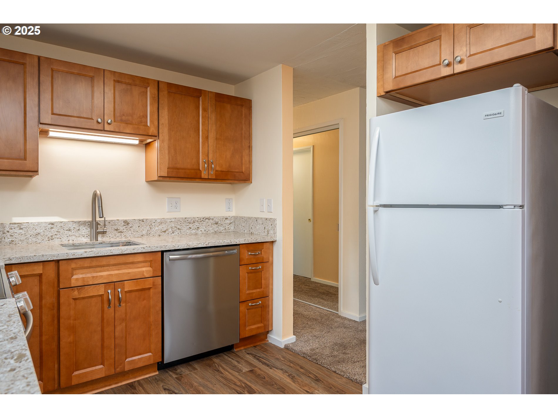 13020 Northeast San Rafael Street Portland, OR 97230 - Photo 11 of 35 a kitchen with stainless steel appliances granite countertop a refrigerator a sink and dishwasher