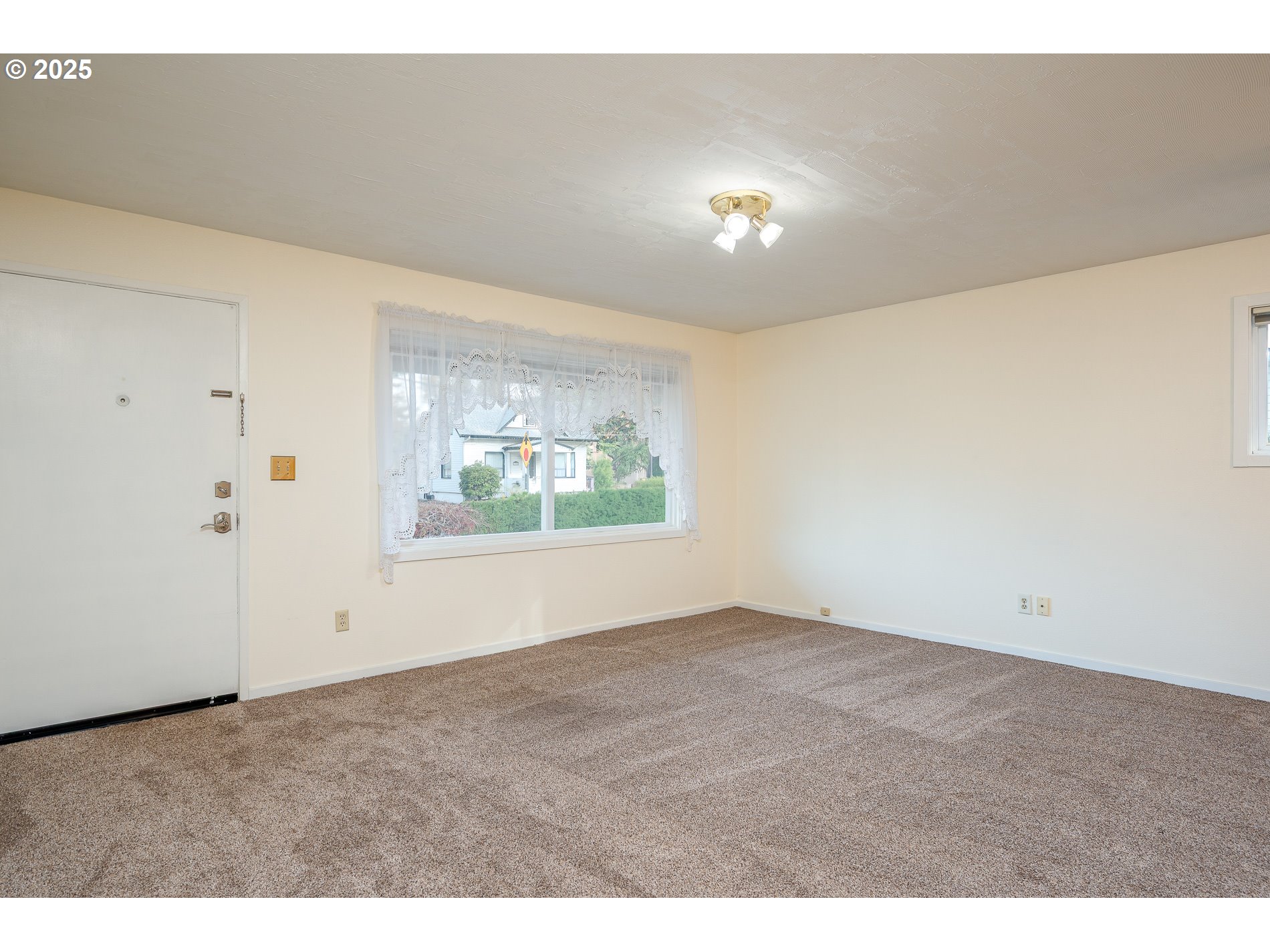 13020 Northeast San Rafael Street Portland, OR 97230 - Photo 16 of 35 a view of an empty room with a window