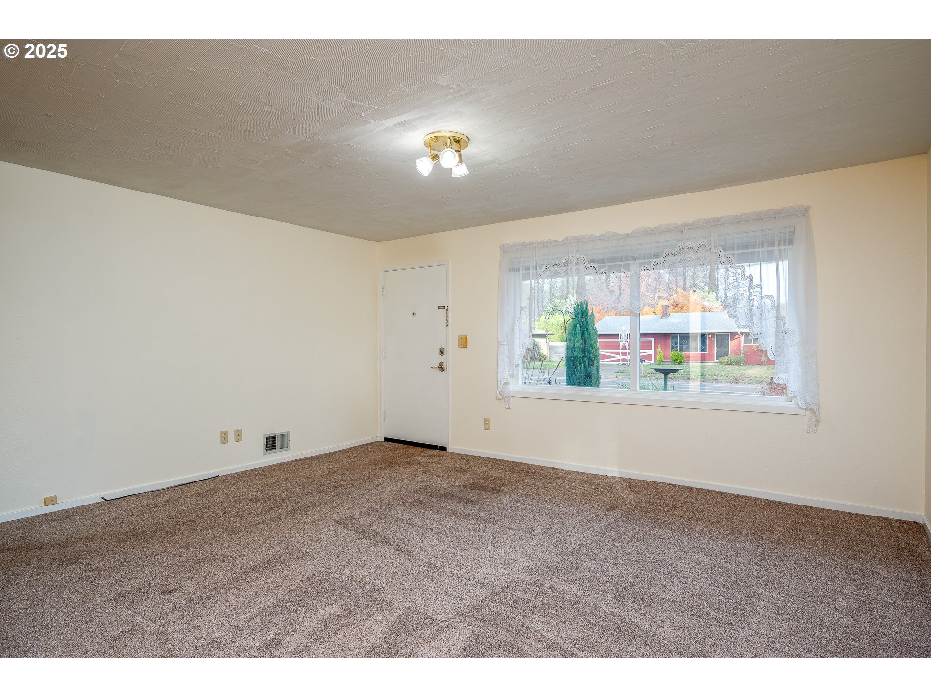 13020 Northeast San Rafael Street Portland, OR 97230 - Photo 20 of 35 a view of an empty room with a window