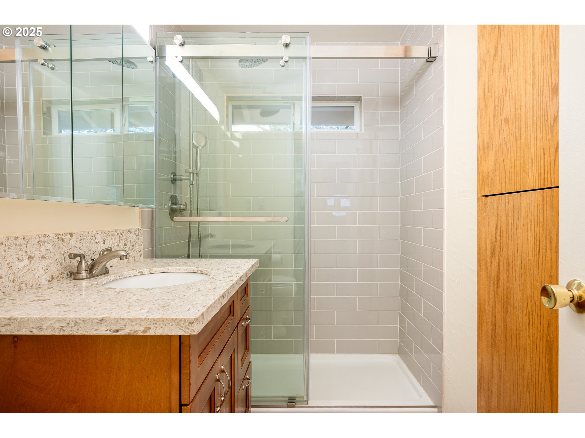 13020 Northeast San Rafael Street Portland, OR 97230 - Photo 22 of 35 a bathroom with a sink and a mirror