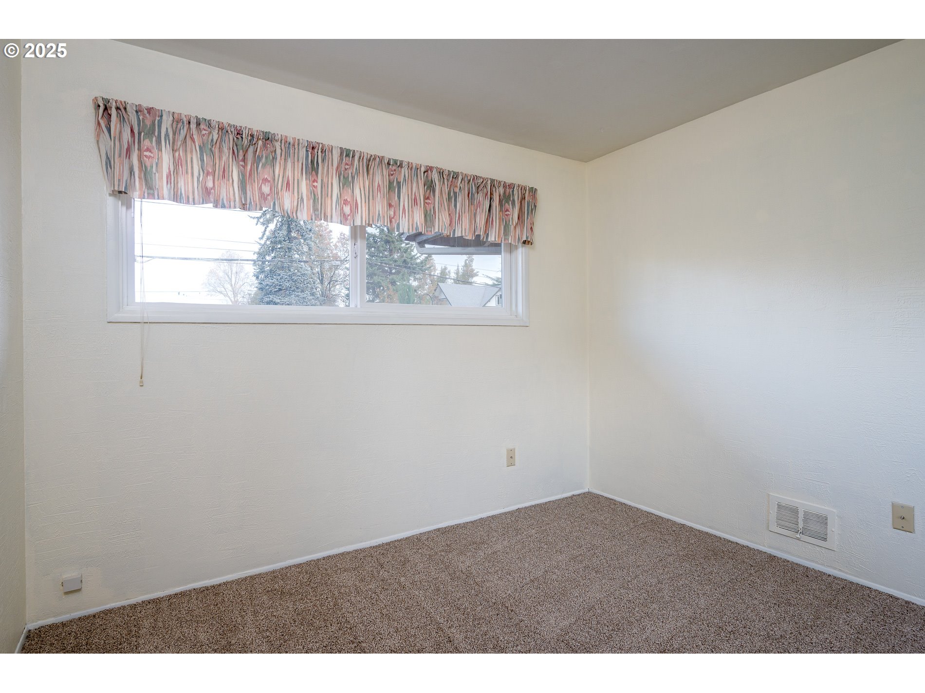 13020 Northeast San Rafael Street Portland, OR 97230 - Photo 25 of 35 a view of an empty room with a window