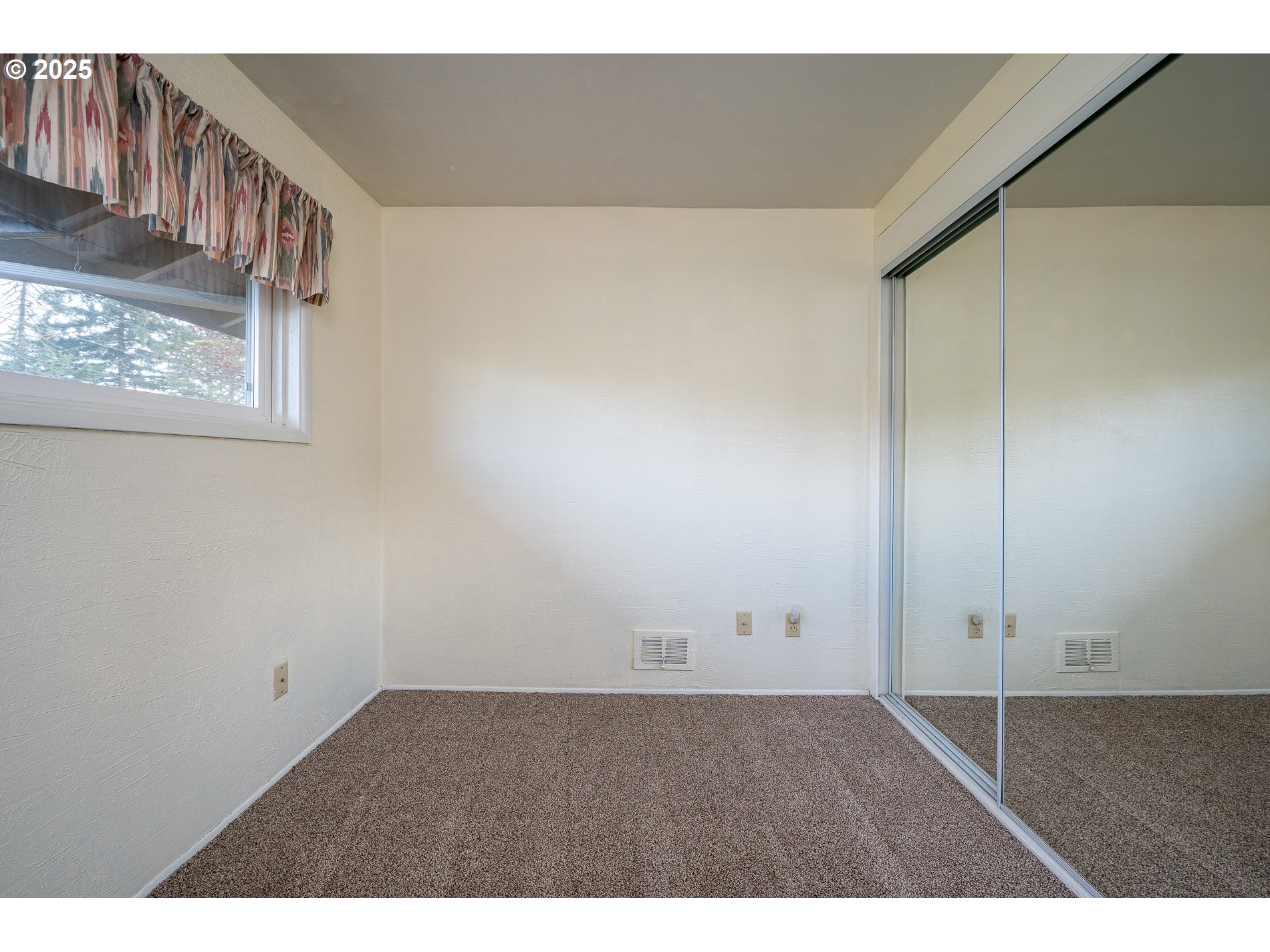 13020 Northeast San Rafael Street Portland, OR 97230 - Photo 26 of 35 a view of an empty room with wooden floor
