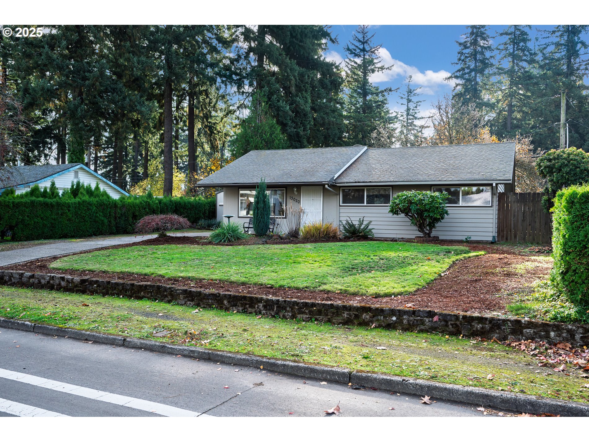 13020 Northeast San Rafael Street Portland, OR 97230 - Photo 3 of 35 a front view of a house with a yard