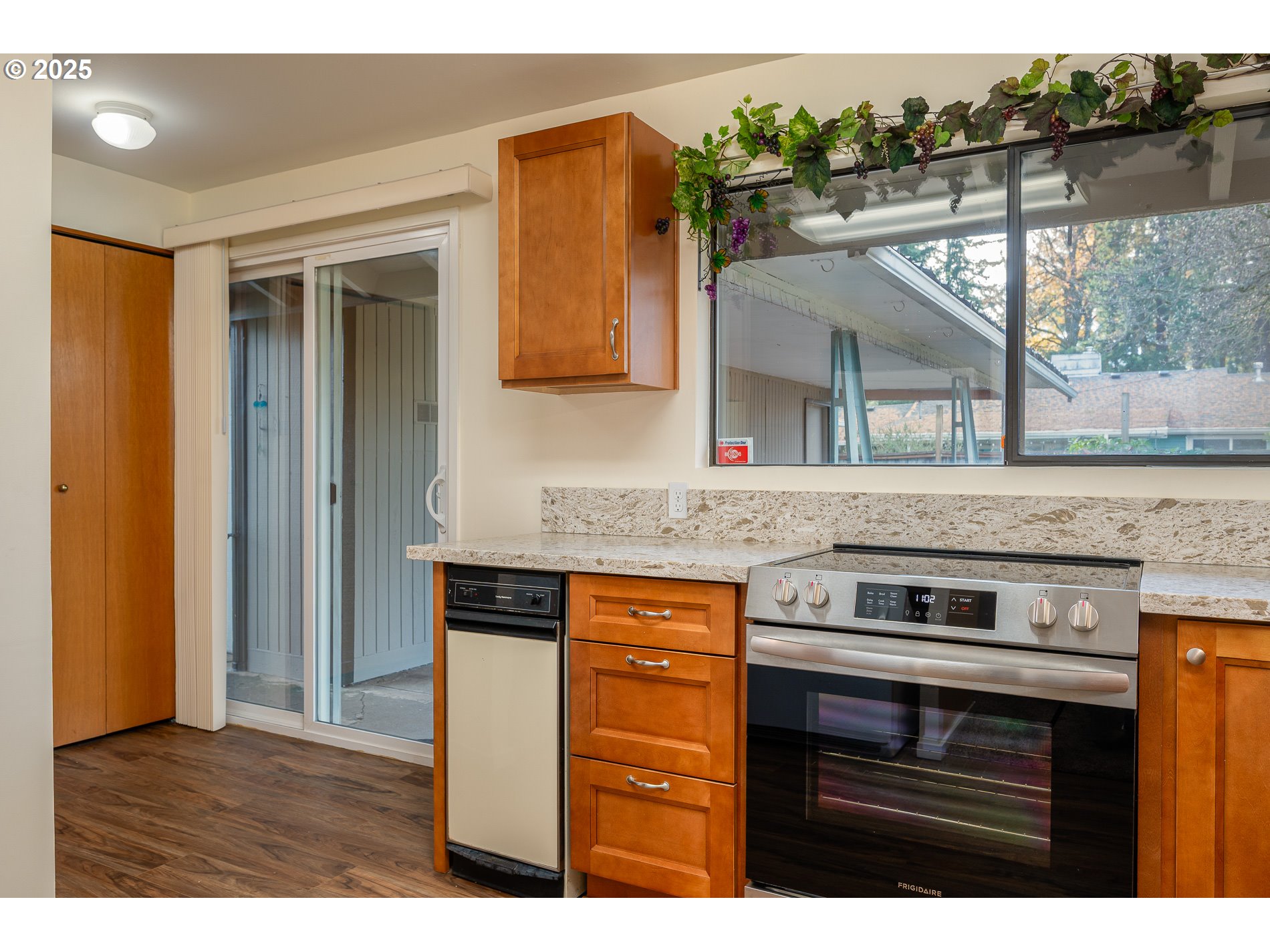 13020 Northeast San Rafael Street Portland, OR 97230 - Photo 8 of 35 a kitchen with a stove and a microwave