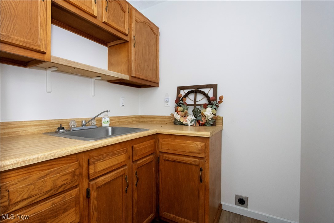 2781 North Firestone Road Wooster, OH 44691 - Photo 21 of 41 Kitchen featuring hardwood / wood-style flooring and sink
