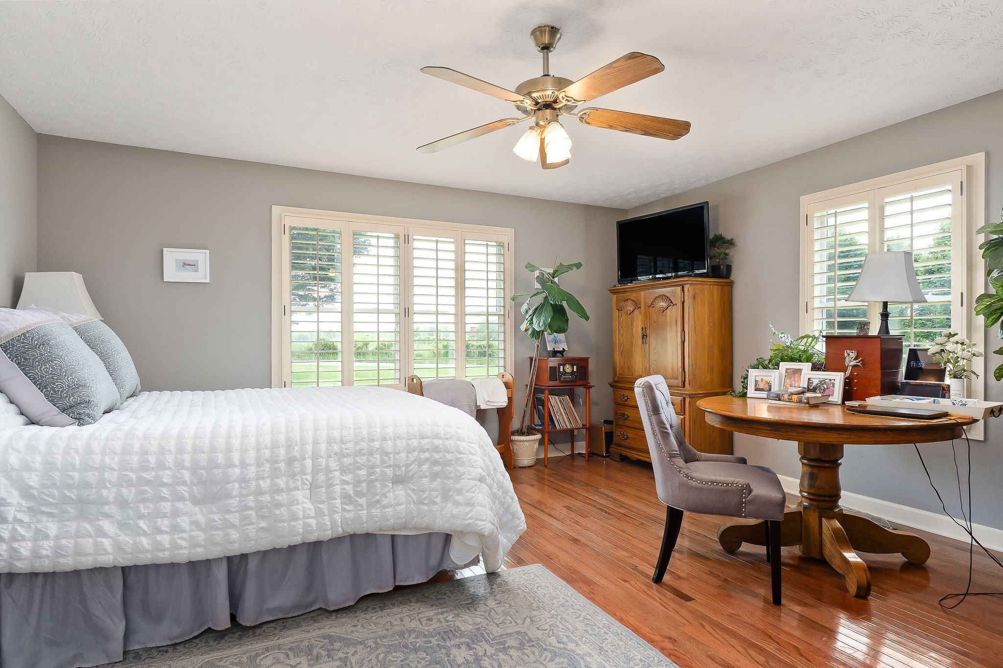 1051 Herman Lance Road Morrison, TN 37357 - Photo 16 of 57 a bedroom with a bed a desk and chair with windows