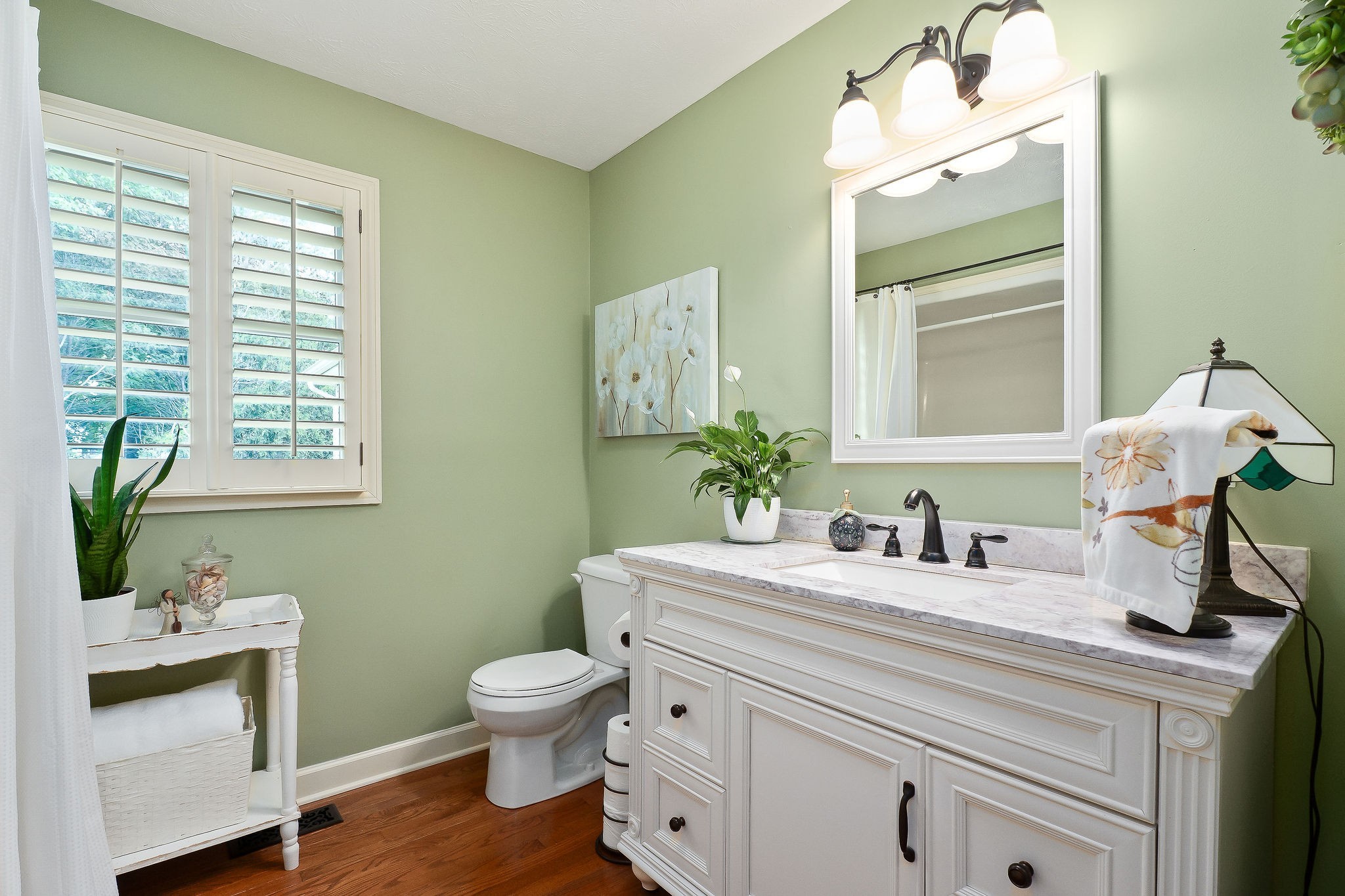 1051 Herman Lance Road Morrison, TN 37357 - Photo 25 of 57 a bathroom with a toilet a sink and mirror