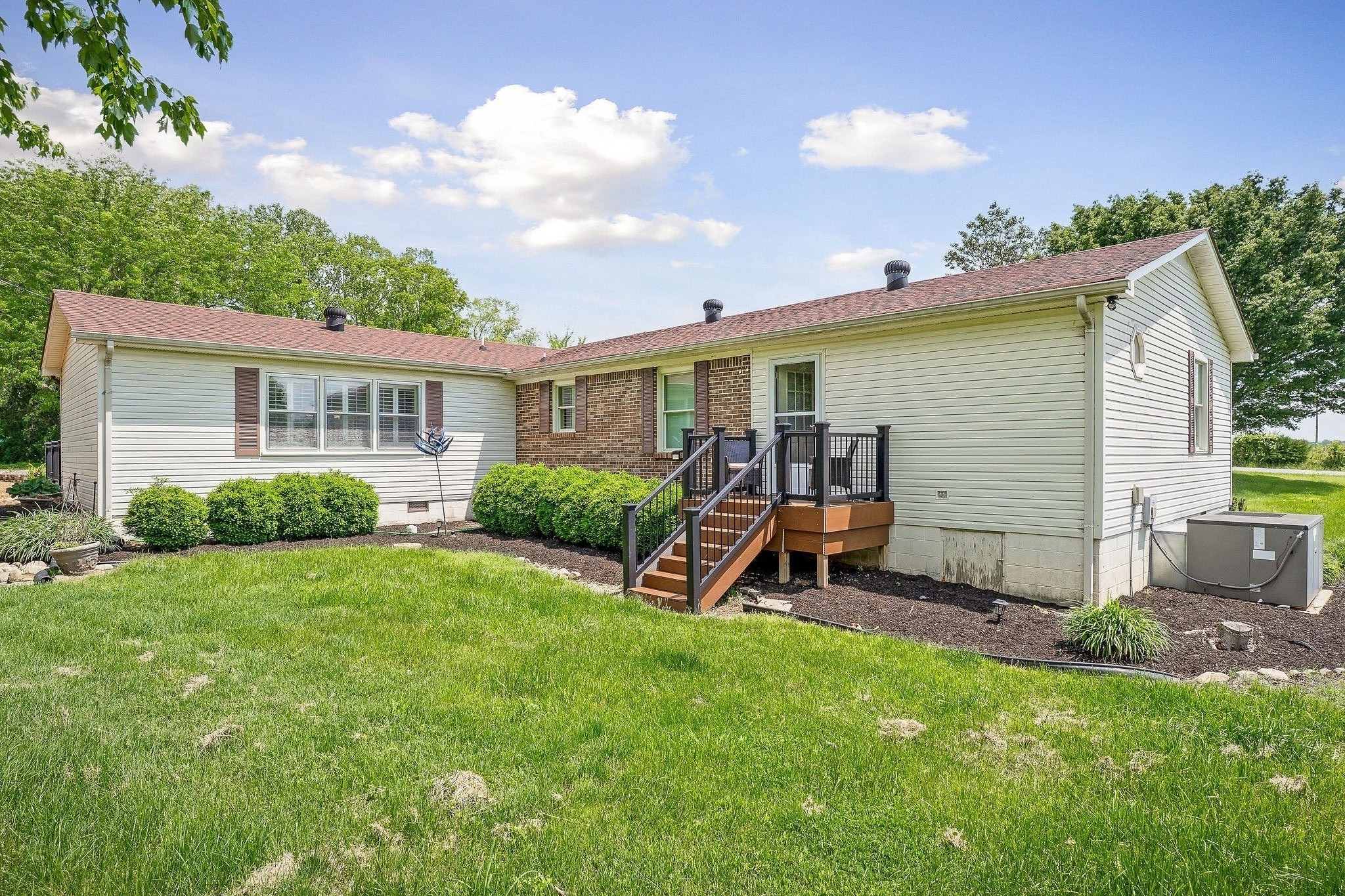 1051 Herman Lance Road Morrison, TN 37357 - Photo 33 of 57 a view of a house with a backyard and sitting area