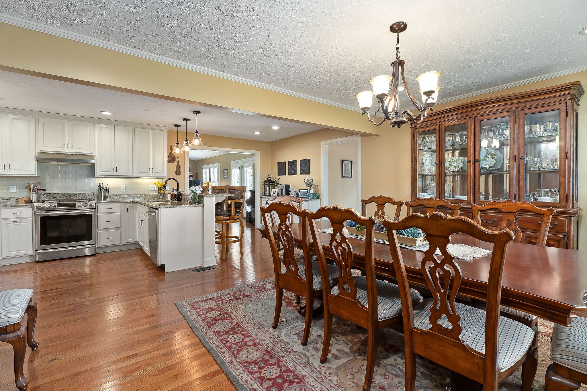 1051 Herman Lance Road Morrison, TN 37357 - Photo 7 of 57 a view of a dining room with furniture a chandelier and wooden floor