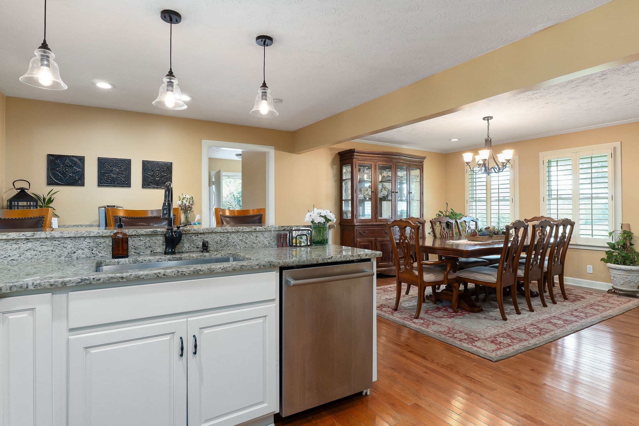 1051 Herman Lance Road Morrison, TN 37357 - Photo 10 of 57 a view of a dining room and livingroom with furniture wooden floor a chandelier