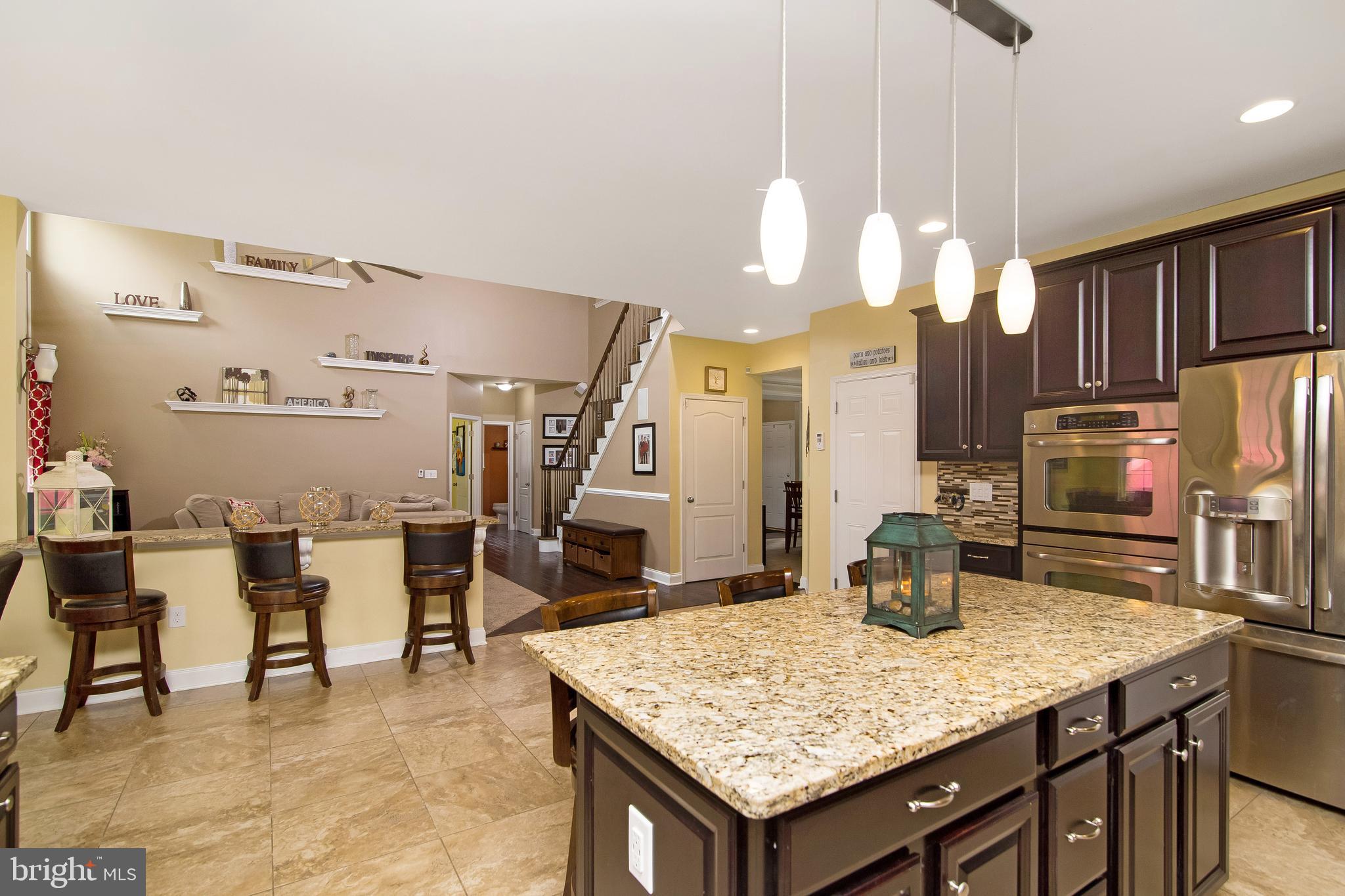504 Windsor Road Mullica Hill, NJ 08062 - Photo 12 of 48 Notice the Breakfast /lunch bar area w/ view of TV