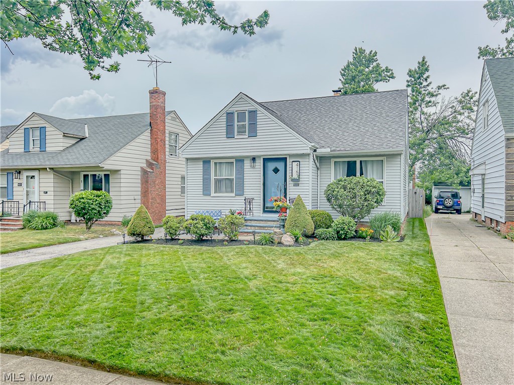 4157 Verona Road Cleveland, OH 44121 - Photo 1 of 26 Bungalow-style home with a chimney, a front lawn, and a shingled roof