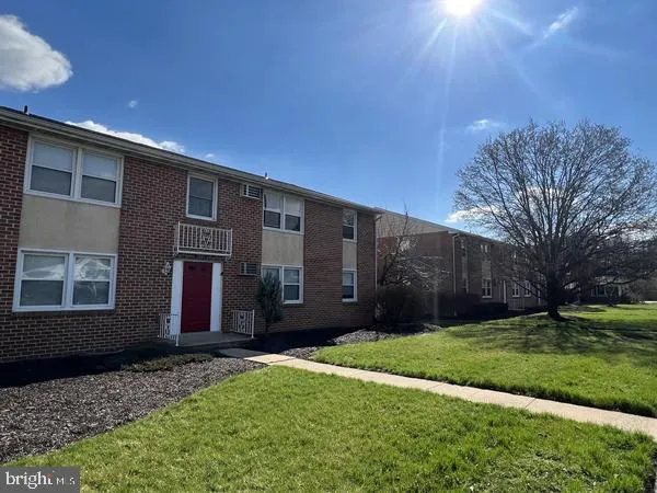 a view of house with yard