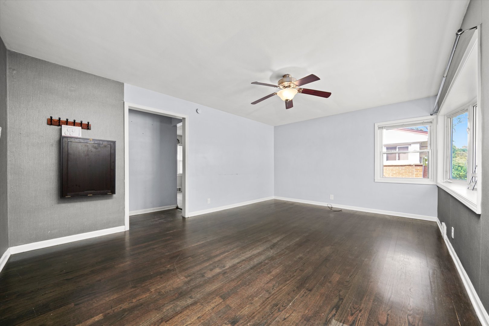 706 North Main Street Mount Prospect, IL 60056 - Photo 4 of 14 an empty room with wooden floor and windows