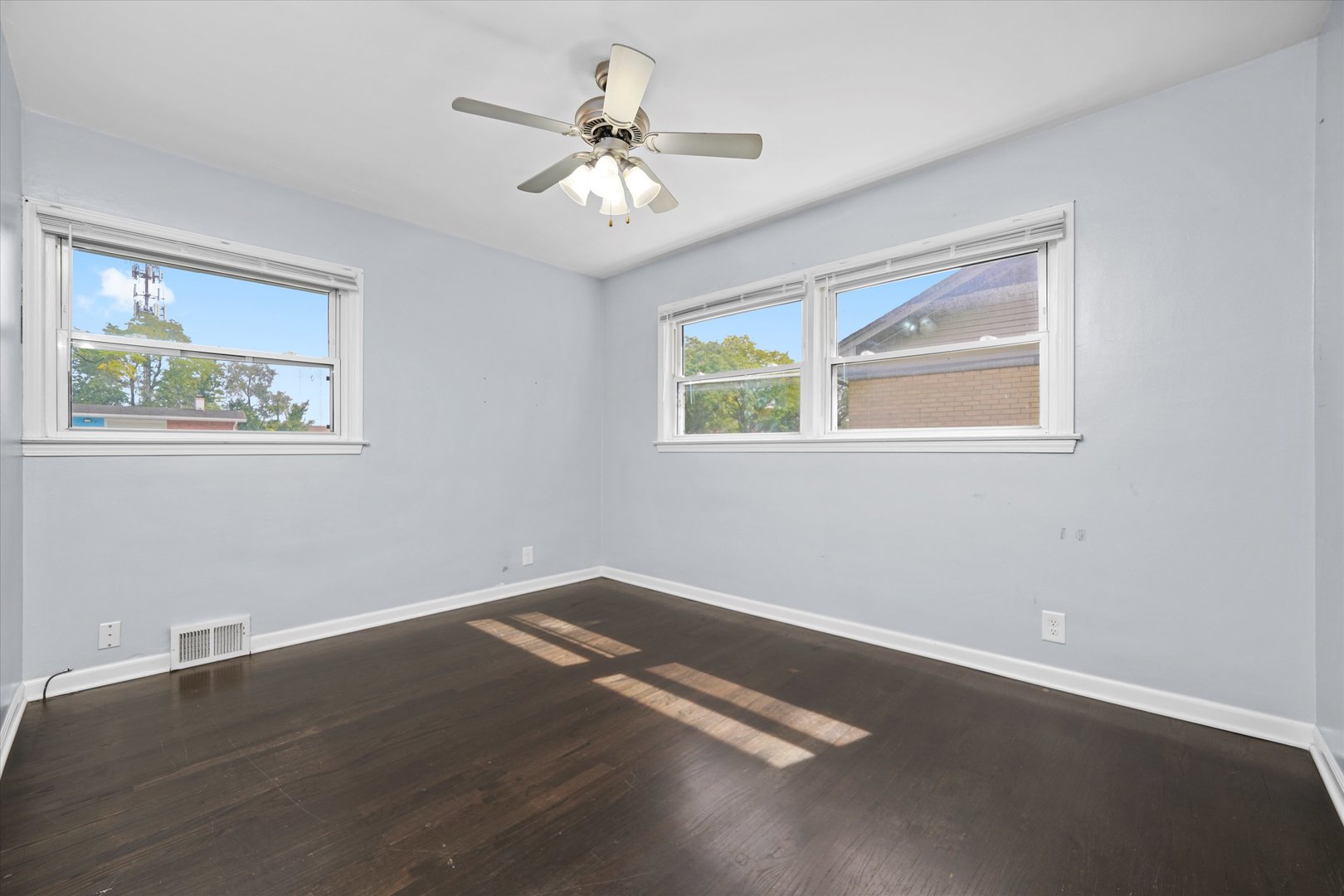 706 North Main Street Mount Prospect, IL 60056 - Photo 8 of 14 a view of an empty room with wooden floor and a window