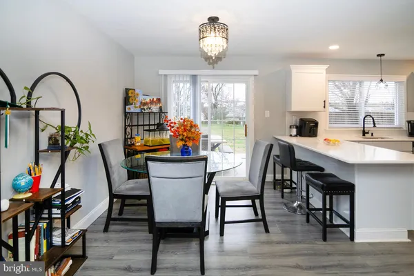 a dining room filled with furniture and window
