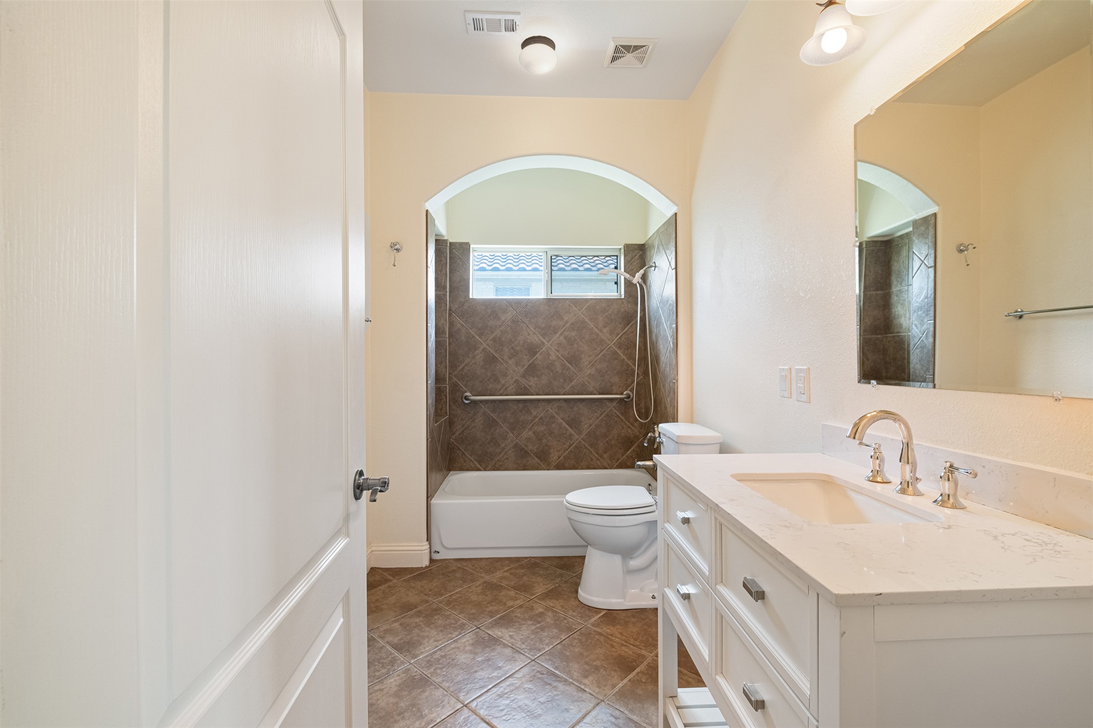 14909 Spillman Ranch Loop Austin, TX 78738 - Photo 20 of 40 Bathroom featuring shower / bathtub combination, visible vents, toilet, and vanity