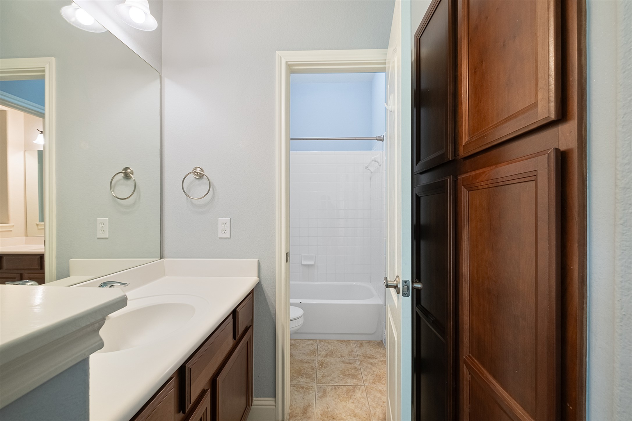14909 Spillman Ranch Loop Austin, TX 78738 - Photo 26 of 40 Bathroom with vanity, tile patterned flooring, shower combination, and toilet