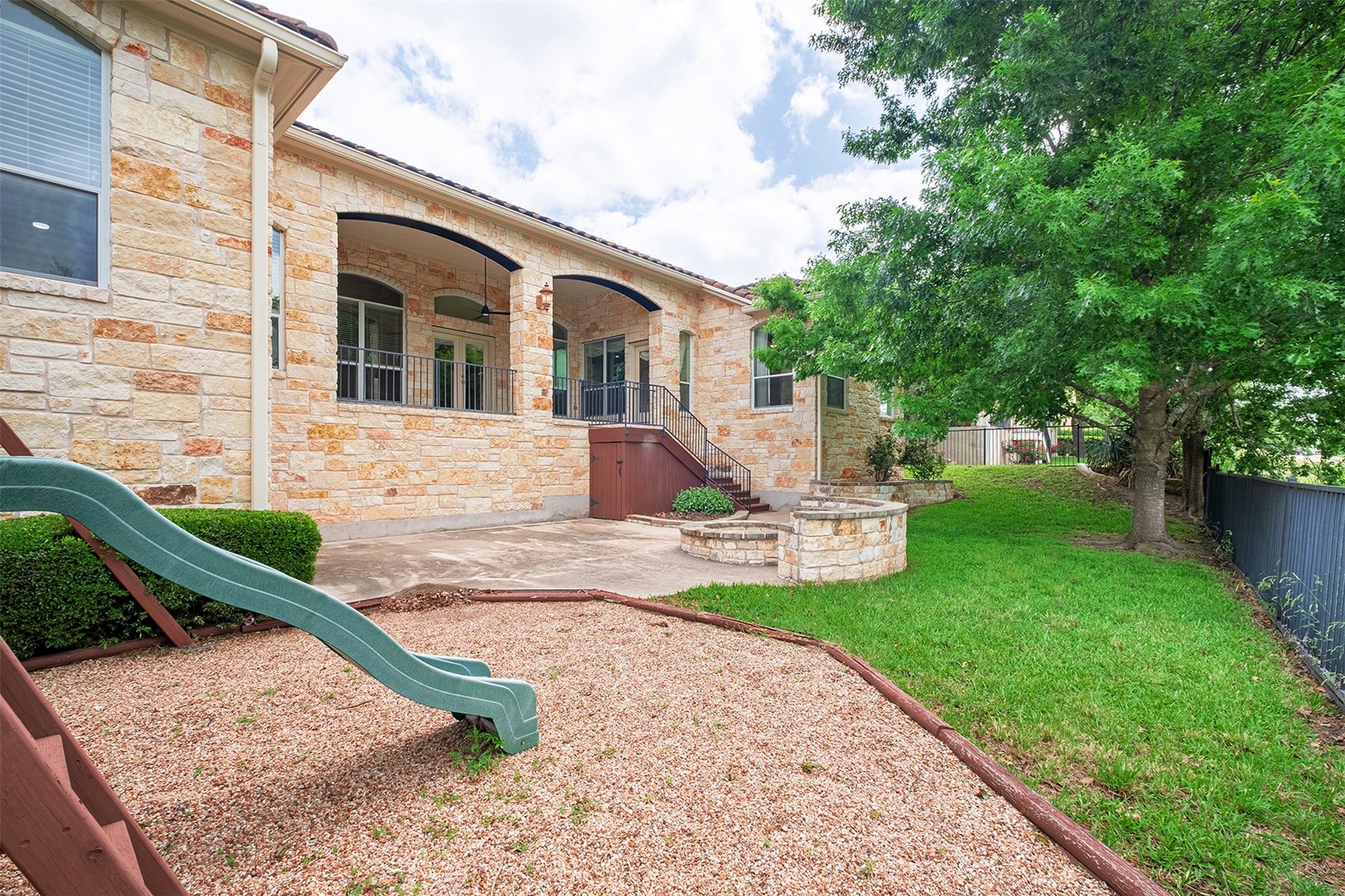 14909 Spillman Ranch Loop Austin, TX 78738 - Photo 38 of 40 View of yard with a fenced backyard, a ceiling fan, and a patio