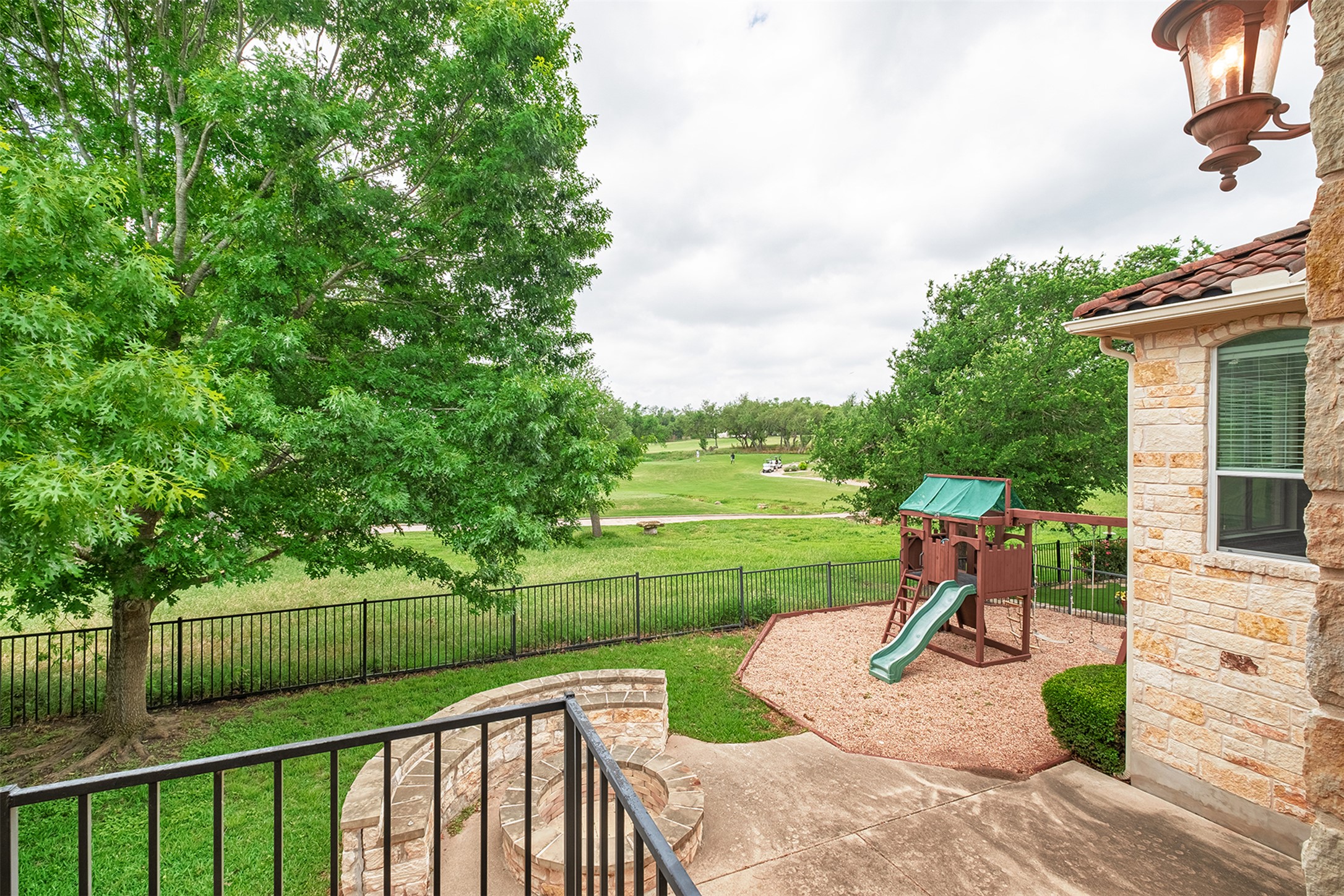 14909 Spillman Ranch Loop Austin, TX 78738 - Photo 40 of 40 View of yard with a fenced backyard and a playground