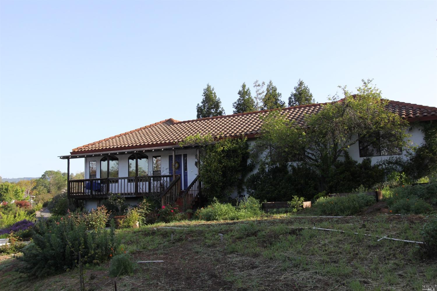 1580 Chablis Road Healdsburg, CA 95448 - Photo 1 of 1 a view of a house with a yard and potted plants