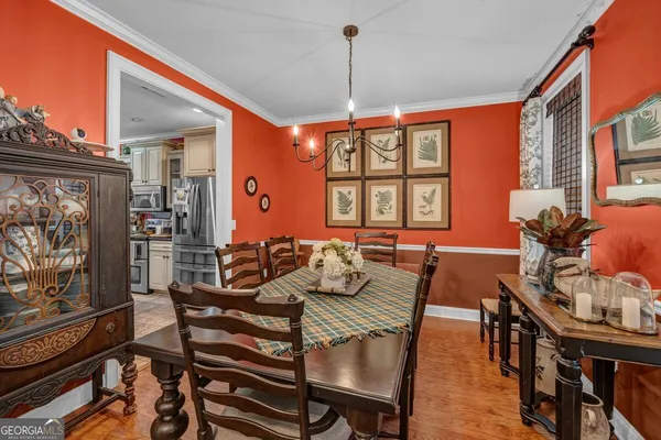 a view of a dining room with furniture window and outside view