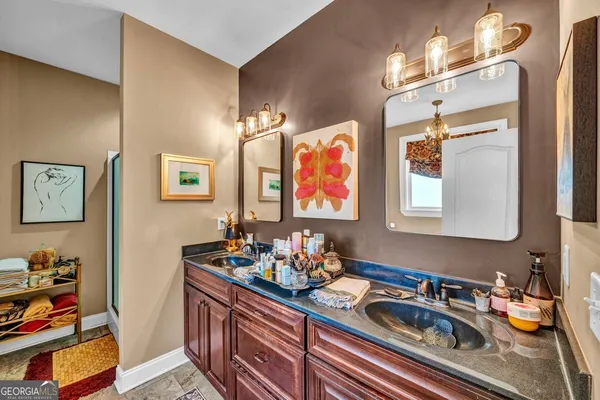 a kitchen with stainless steel appliances a stove and cabinets