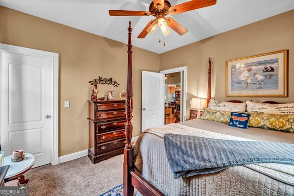 a bedroom with furniture and a chandelier