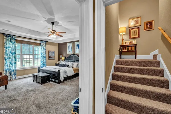 a bedroom with a bed and a television