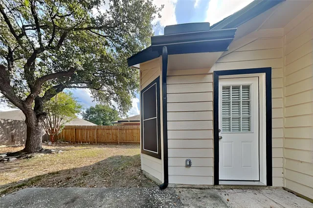 a view of a house with a back yard