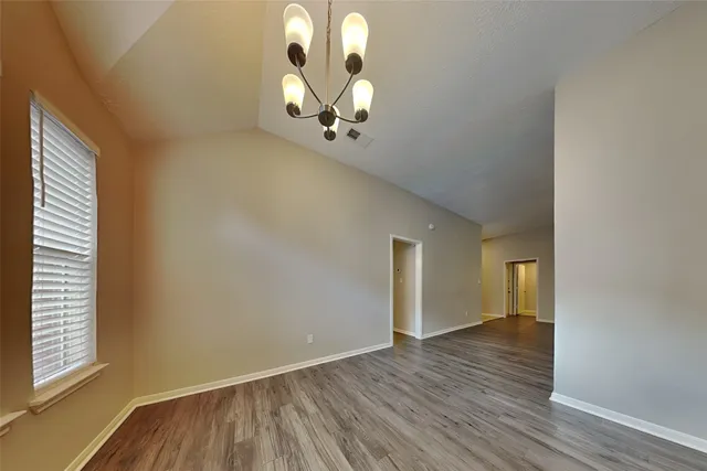 a view of a livingroom with wooden floor