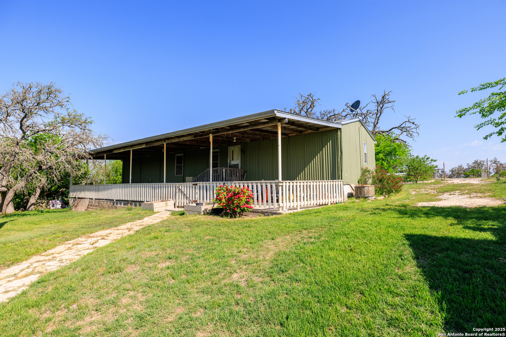 453 Reeves Lane Harper, TX 78631 - Photo 18 of 31 a view of a house with yard and deck