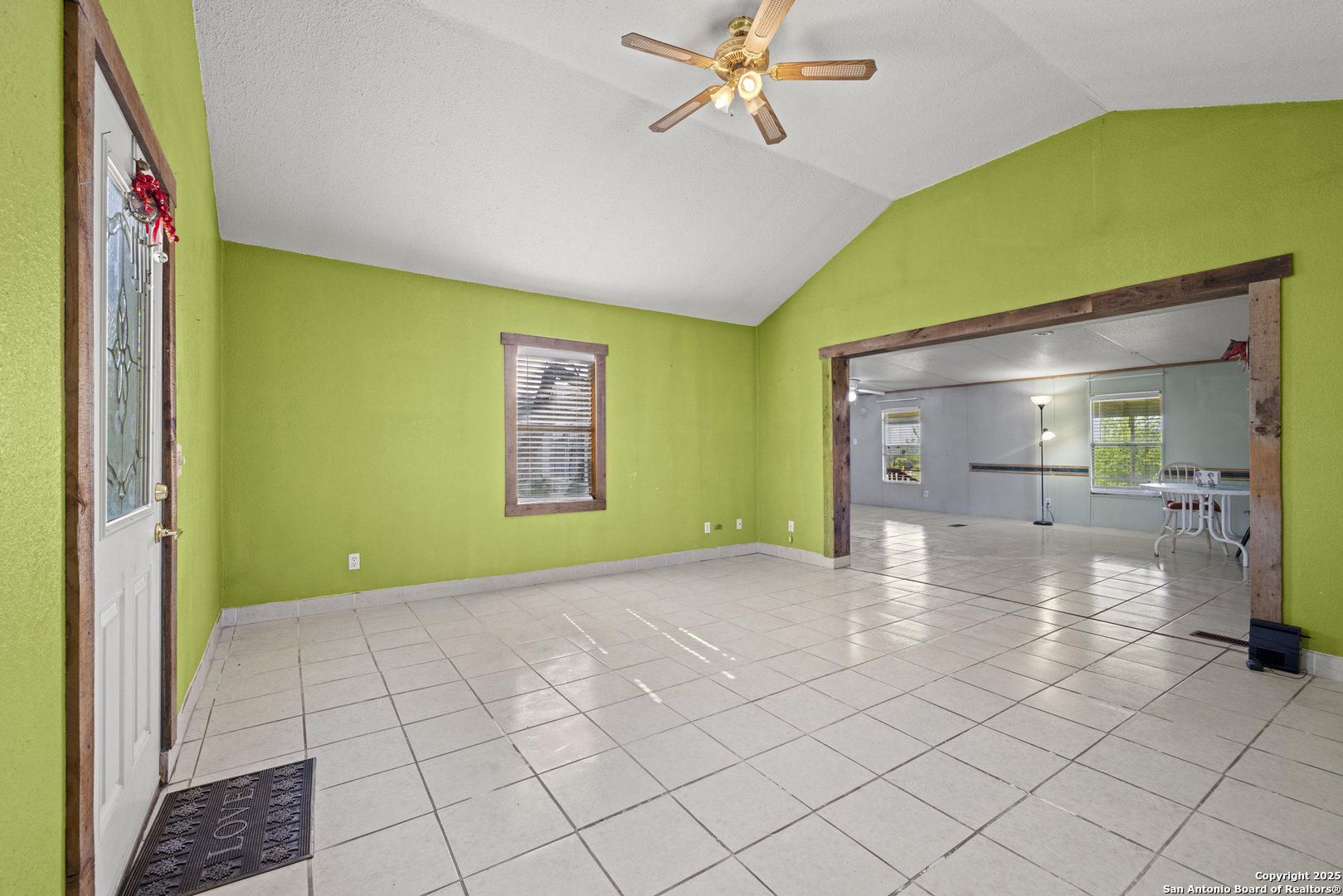 453 Reeves Lane Harper, TX 78631 - Photo 7 of 31 a view of a room with window a ceiling fan and refrigerator