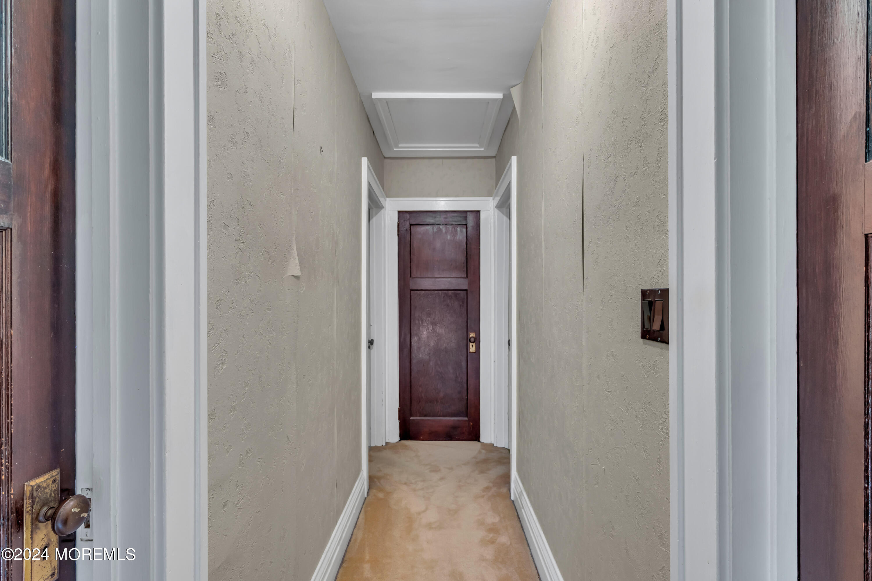 53 Estelle Lane Howell, NJ 07731 - Photo 19 of 36 a view of a hallway with a white wooden door