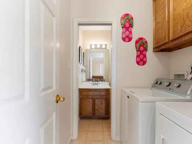 a view of storage and utility room with washer and dryer