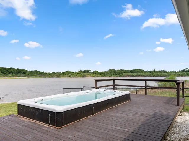a view of a terrace with couches and wooden floor