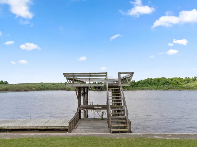 a house view with a lake in the background