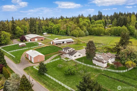 an aerial view of residential houses with outdoor space and street view