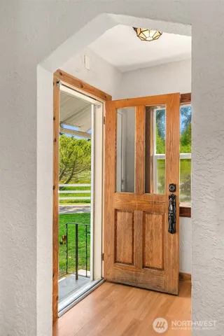 a kitchen with stainless steel appliances a stove a refrigerator and a window