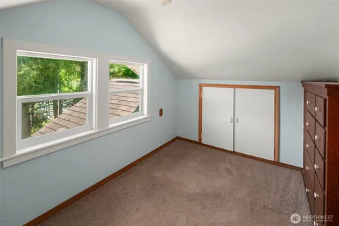 a view of a room with wooden walls