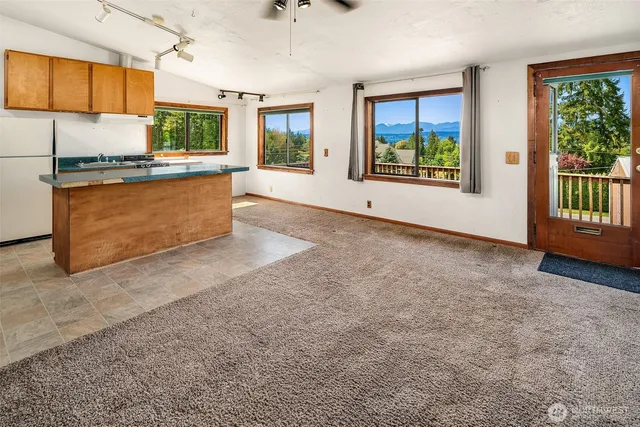 a view of an empty room with windows