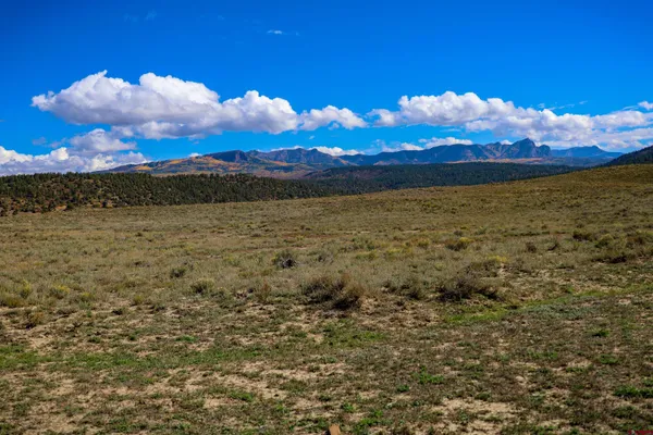 a view of an ocean and a mountain