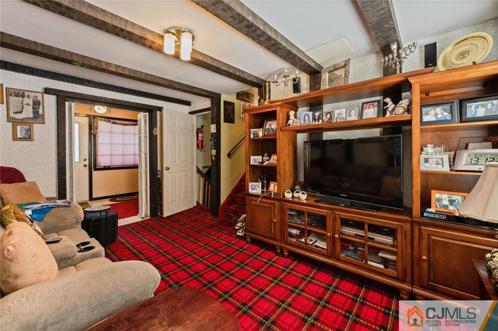10 Monaghan Road Edison, NJ 08817 - Photo 13 of 23 a living room with furniture and a flat screen tv