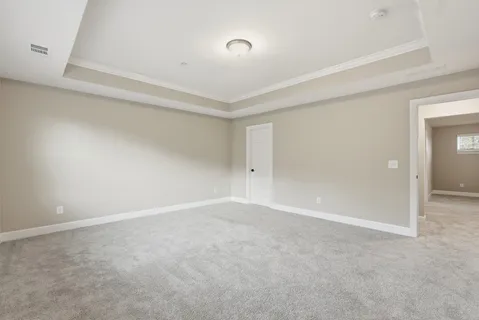 a view of an empty room and a window