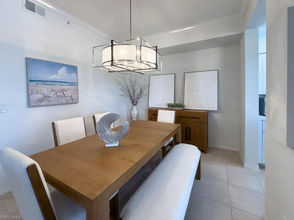 an aerial view of a city space with a lake view in back